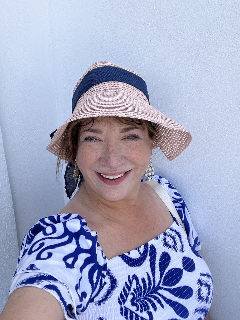 Michele standing in even sunlight for ideal travel photography lighting