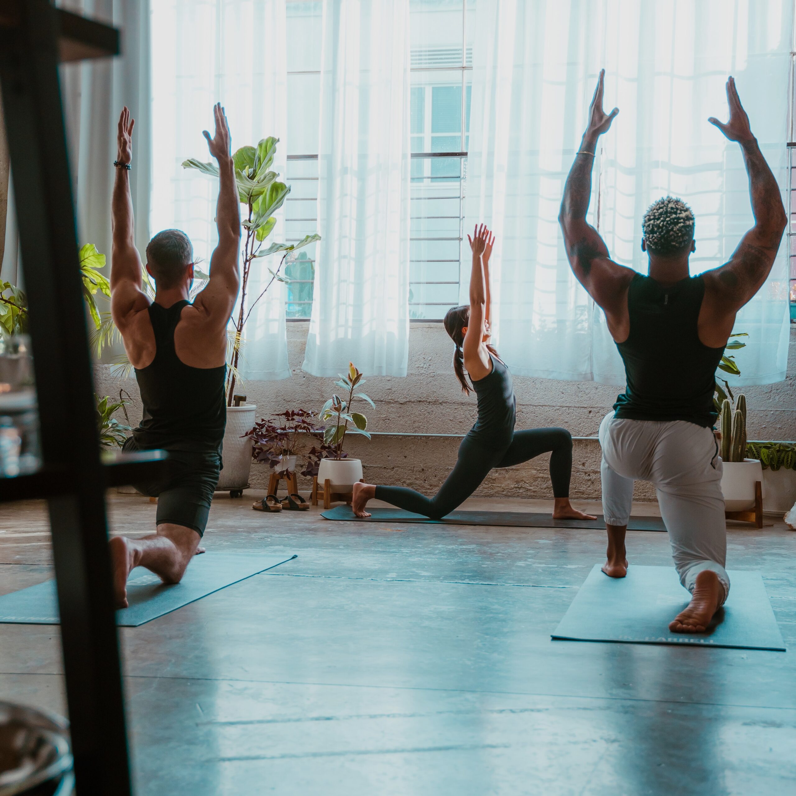 Woman practicing yoga near a peaceful spa pool with natural surroundings