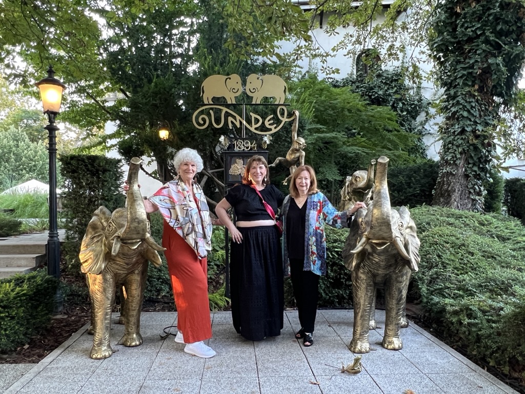 Women striking a flattering pose with good posture outdoors in a travel setting