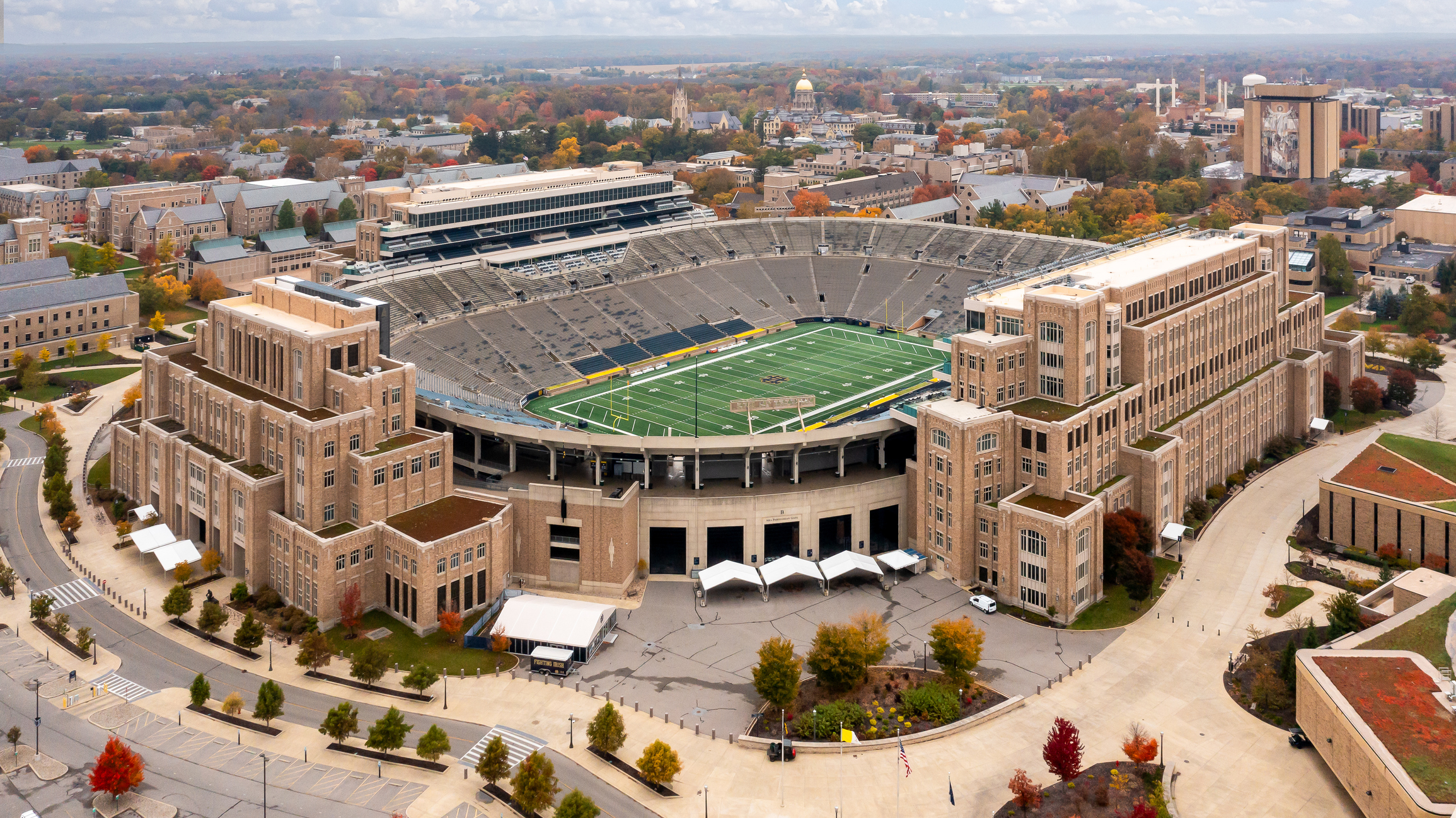 Exterior shot of Notre Dame Stadium with the Touchdown Jesus mural in the background.