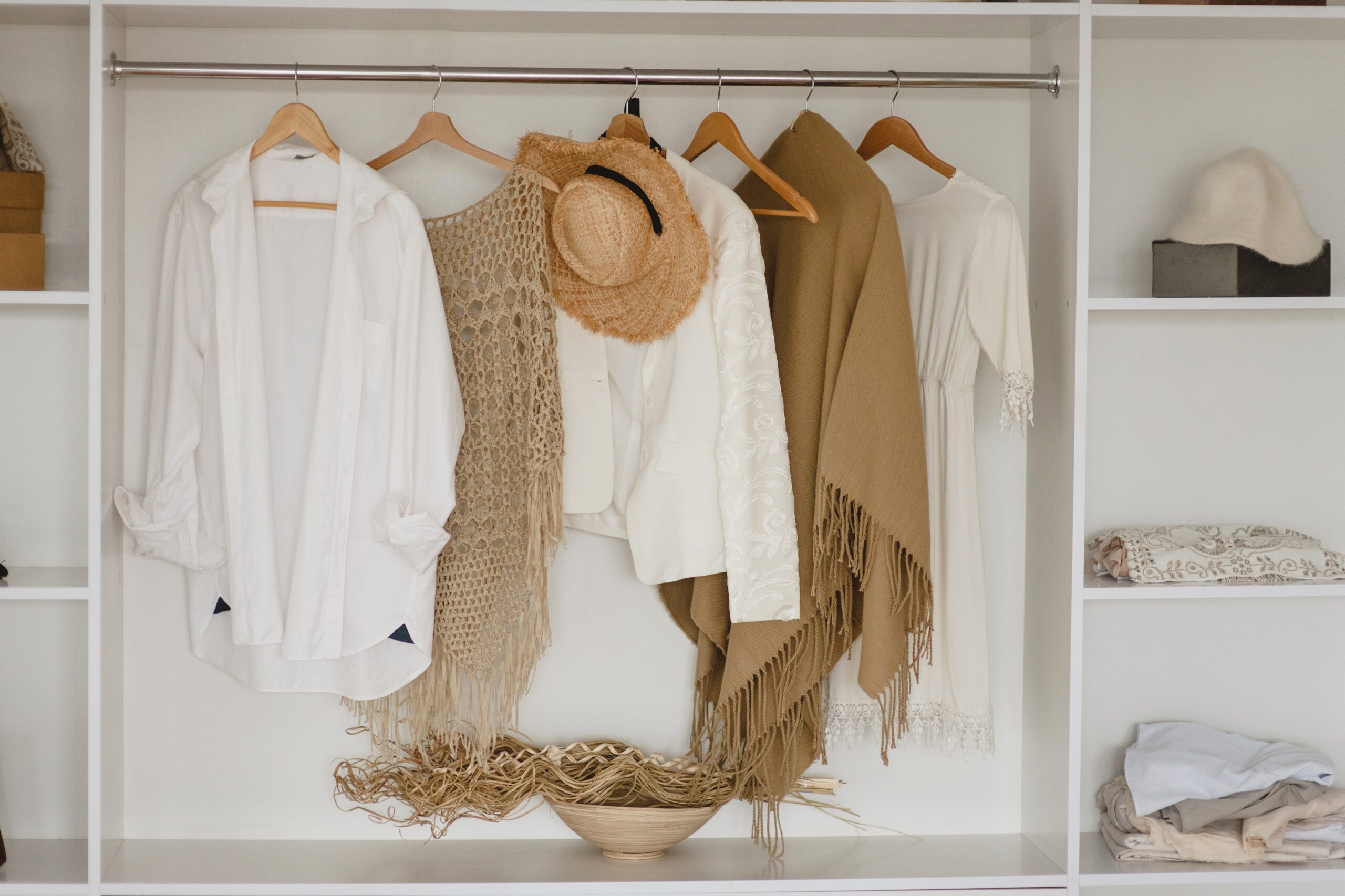 Neatly planned travel outfits laid out for each day, illustrating how pre-planning wardrobe choices reduces morning stress and boosts confidence on the road.
