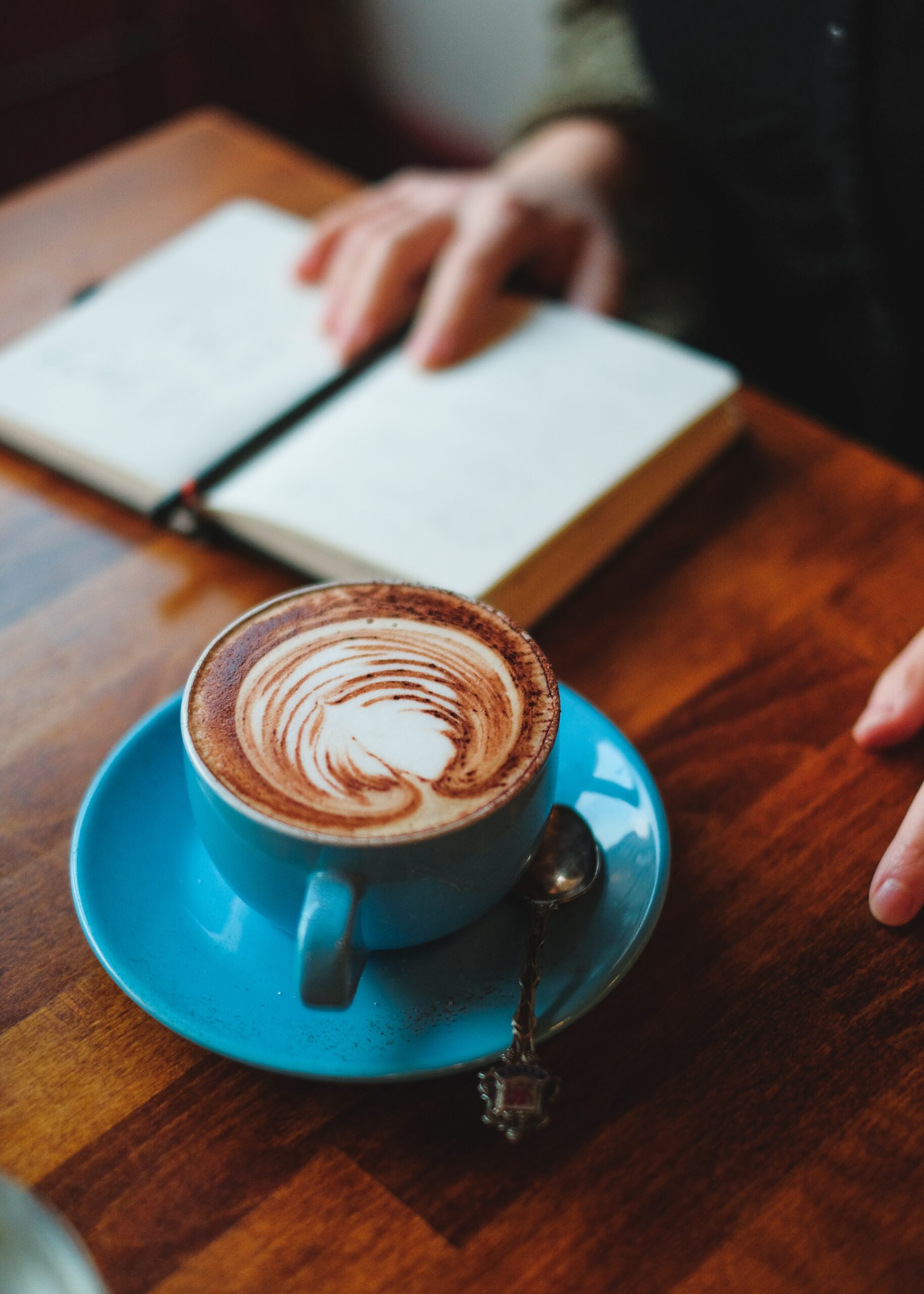 Cozy small town street with fall foliage, café lights, and cinematic atmosphere representing TV show travel destinations and set-jetting experiences
