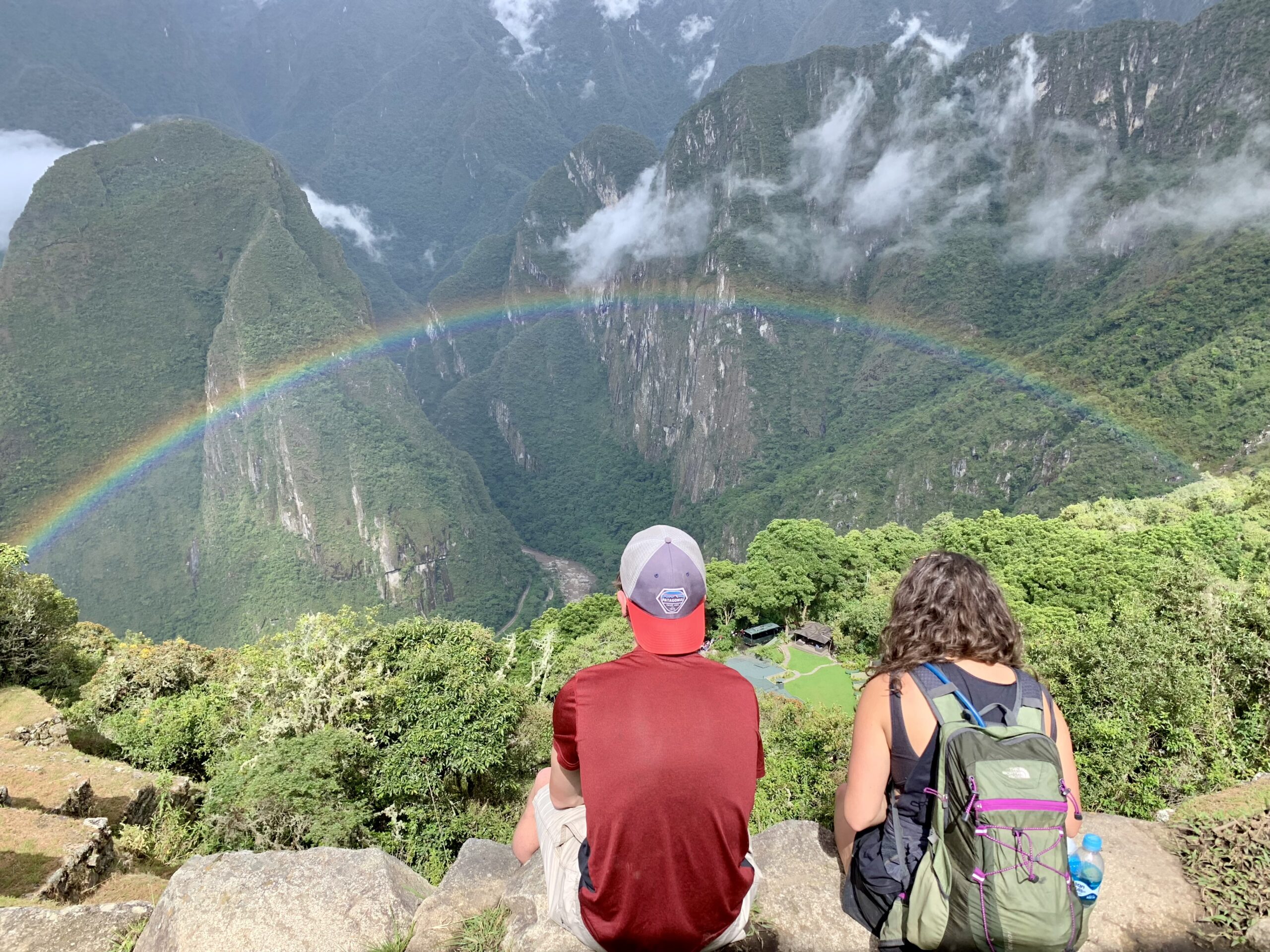 couple arriving at dream set-jetting destination with travel advisor planning