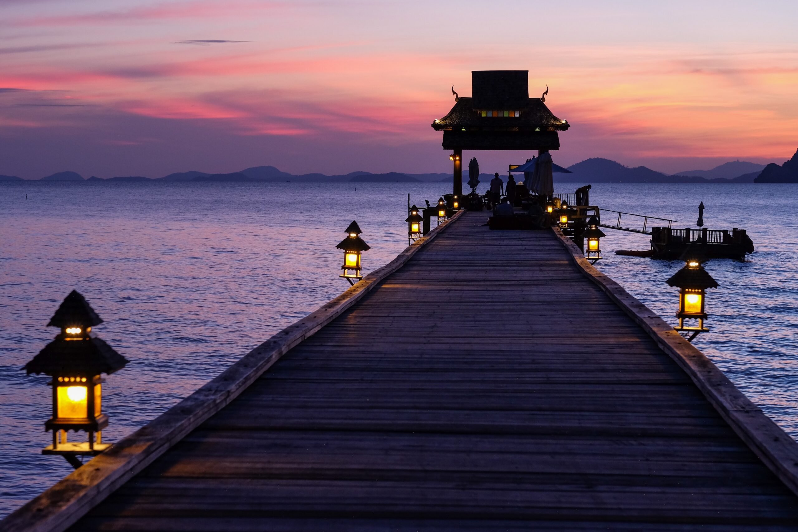 Luxury resort sunset pier overlooking tropical landscape in Thailand